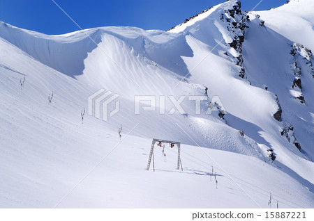 Old surface lift and mountains with snow cornice 15887221