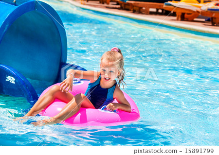 Kid sitting on inflatable ring. Kid sitting on inflatable ring. 15891799