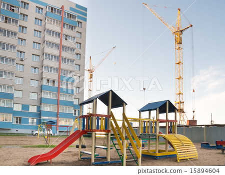 crane and a playground crane and a playground 15894604