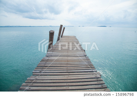 Wooden bridge into the sea. 15896798