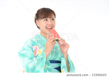 A young Japanese woman in a yukata with watermelon A young Japanese woman in a yukata with watermelon 15898920