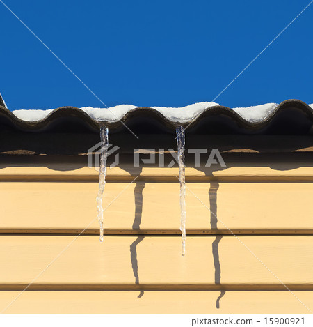 two icicles hanging from the roof two icicles hanging from the roof 15900921