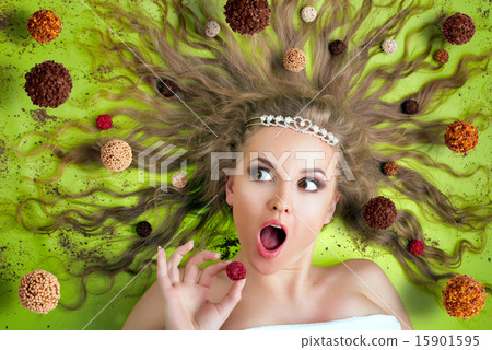 Woman eating candies Woman eating candies 15901595