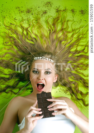 Attractive woman eating chocolate 15901599