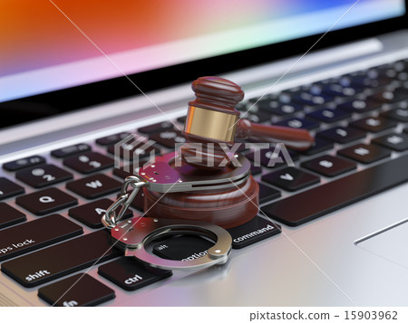 Handcuffs and judge gavel on the laptop keyboard 15903962