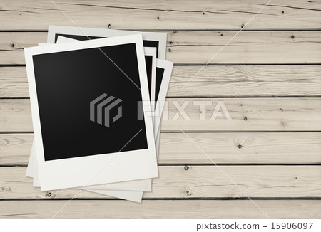 Polaroid photo frames on wooden background 15906097