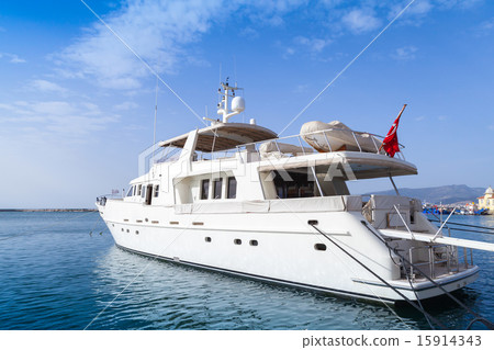 White pleasure motor yacht stands moored in Izmir White pleasure motor yacht stands moored in Izmir 15914343