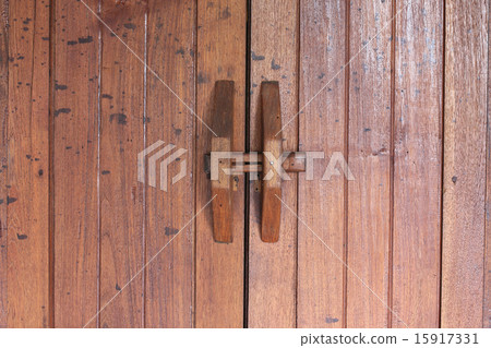 Door handle on brown wood door Door handle on brown wood door 15917331