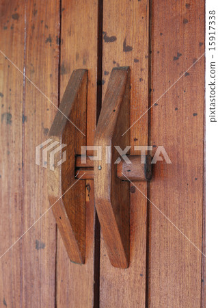 Door handle on brown wood door Door handle on brown wood door 15917338