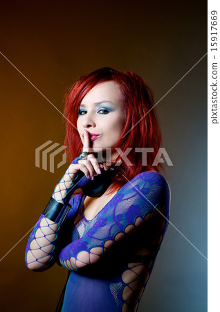 Female DJ with finger at lips. Female DJ with finger at lips. 15917669