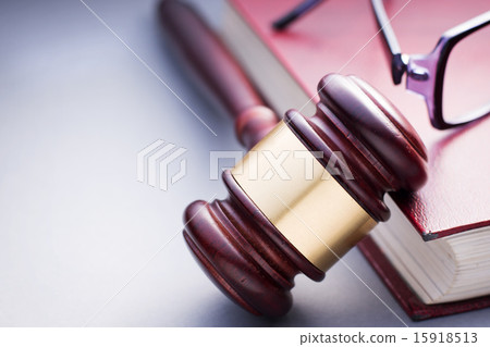 Wooden Gavel Resting on Red Leather Book Wooden Gavel Resting on Red Leather Book 15918513