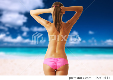 Woman topless on beautiful beach at Seychelles 15919117