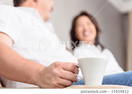 Intercultural family drinking coffee 15919812