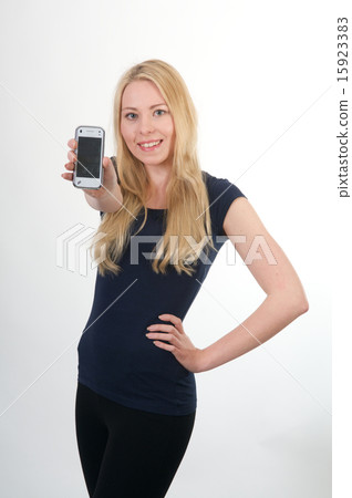 Blond smiling girl showing mobile phone 15923383