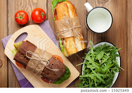 Two sandwiches with salad, ham, cheese 15925849