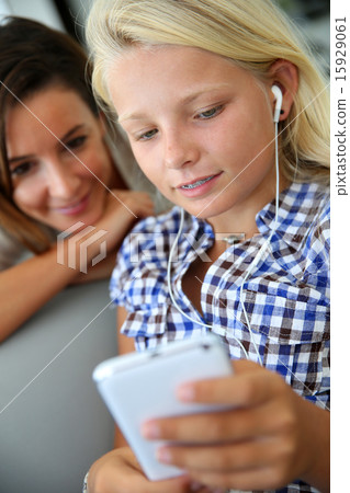 Young girl listening to music 15929061