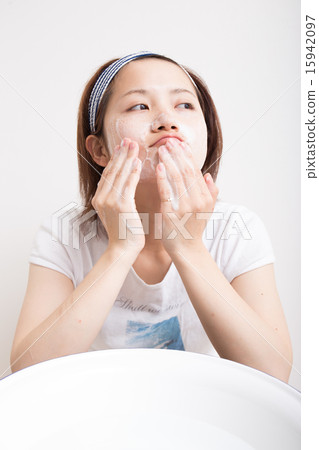Women washing their face Women washing their face 15942097