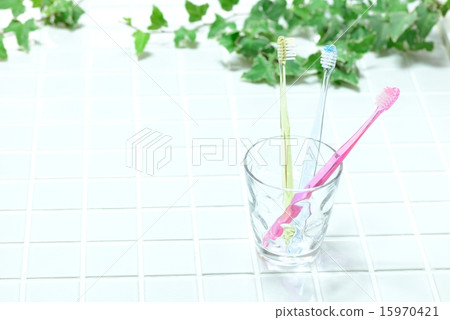 Toothbrush on glass cup Toothbrush on glass cup 15970421
