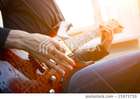 Electric guitar player Electric guitar player 15973730