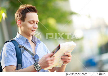 Young man with map Young man with map 15973804