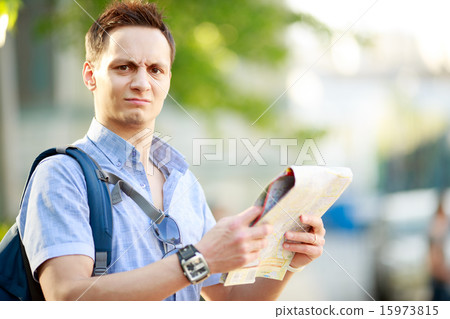 Young man with map Young man with map 15973815