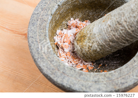 Kitchen mortar and pestle with crashed egg shell Kitchen mortar and pestle with crashed egg shell 15976227