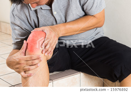 Man suffering painful knee joint rest on stairs 15976892