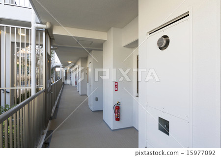 Common hallway of condominium apartment house and water heater electric panel 15977092