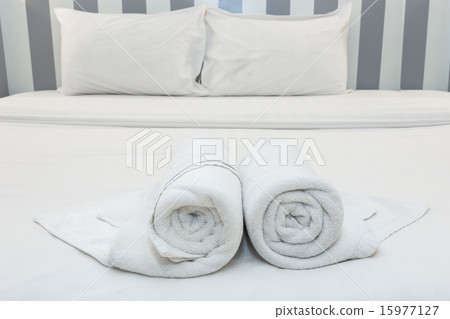 nice towels on white bed sheet with white pillow nice towels on white bed sheet with white pillow 15977127
