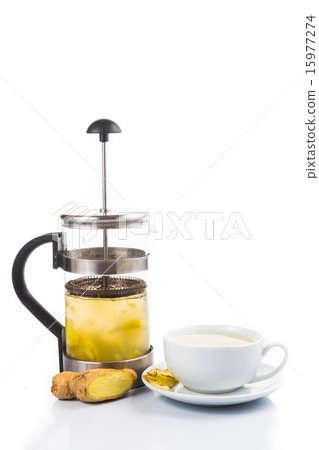 Hot ginger tea in cup with filter jar Hot ginger tea in cup with filter jar 15977274