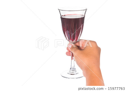 Hand holding red wine in crystal glass Hand holding red wine in crystal glass 15977763