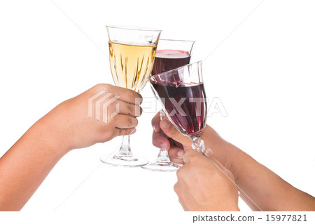 Hands toasting red and white wine in crystal glass Hands toasting red and white wine in crystal glass 15977821