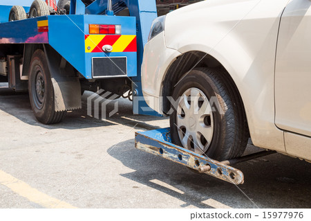Tow truck towing a broken down car Tow truck towing a broken down car 15977976