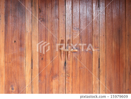Door handle on brown wood door 15979609