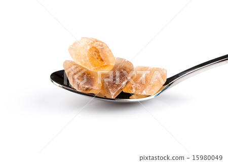 brown caramelized sugar in a wooden spoon 15980049
