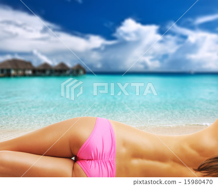Woman topless on tropical beach at Maldives Woman topless on tropical beach at Maldives 15980470
