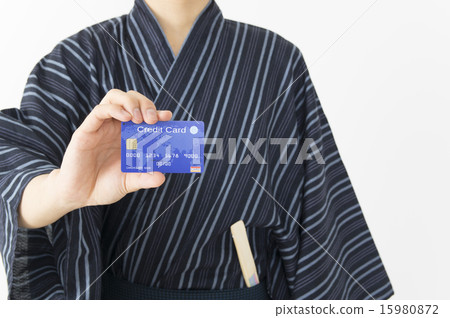 Men showing credit cards in Yukata Men showing credit cards in Yukata 15980872