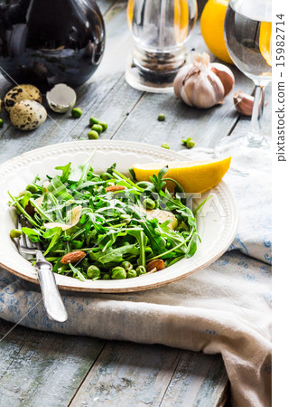 green salad with arugula, cheese, almonds, lemon 15982714