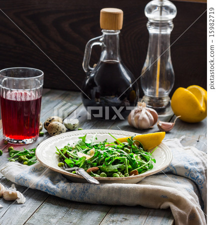 green salad with arugula, cheese, almonds, lemon green salad with arugula, cheese, almonds, lemon 15982719