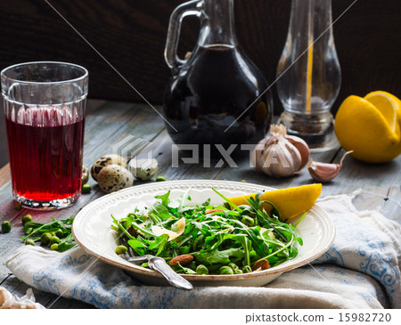 green salad with arugula, cheese, almonds, lemon 15982720