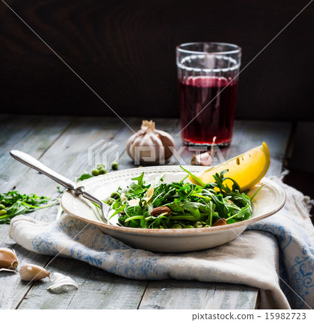 green salad with arugula, cheese, almonds, lemon green salad with arugula, cheese, almonds, lemon 15982723