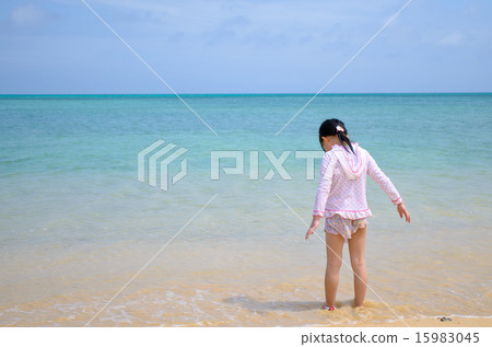 Girls standing on the beach Girls standing on the beach 15983045