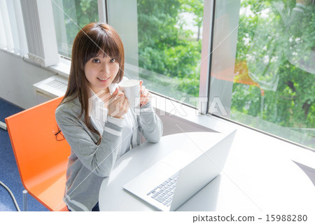 A young woman operating a PC A young woman operating a PC 15988280