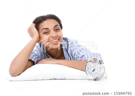 Smiling lying mulatto girl on pillow  15994793