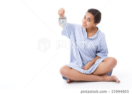 Pretty young mulatto girl holding alarm clock  15994803