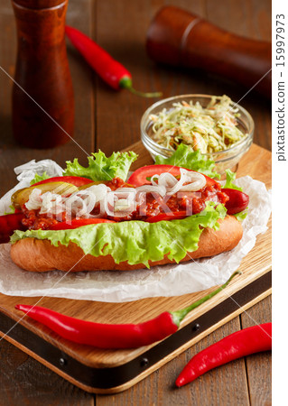 Hot-dog on wooden cutting board 15997973