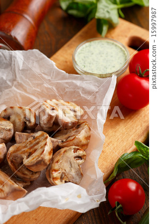 Grilled champignons with sauce 15997987