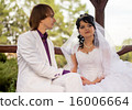 Couple love bride and groom posing sitting on wood 16006664