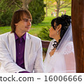 Couple love bride and groom posing sitting on wood 16006666