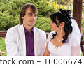 Couple love bride and groom posing sitting on wood 16006674